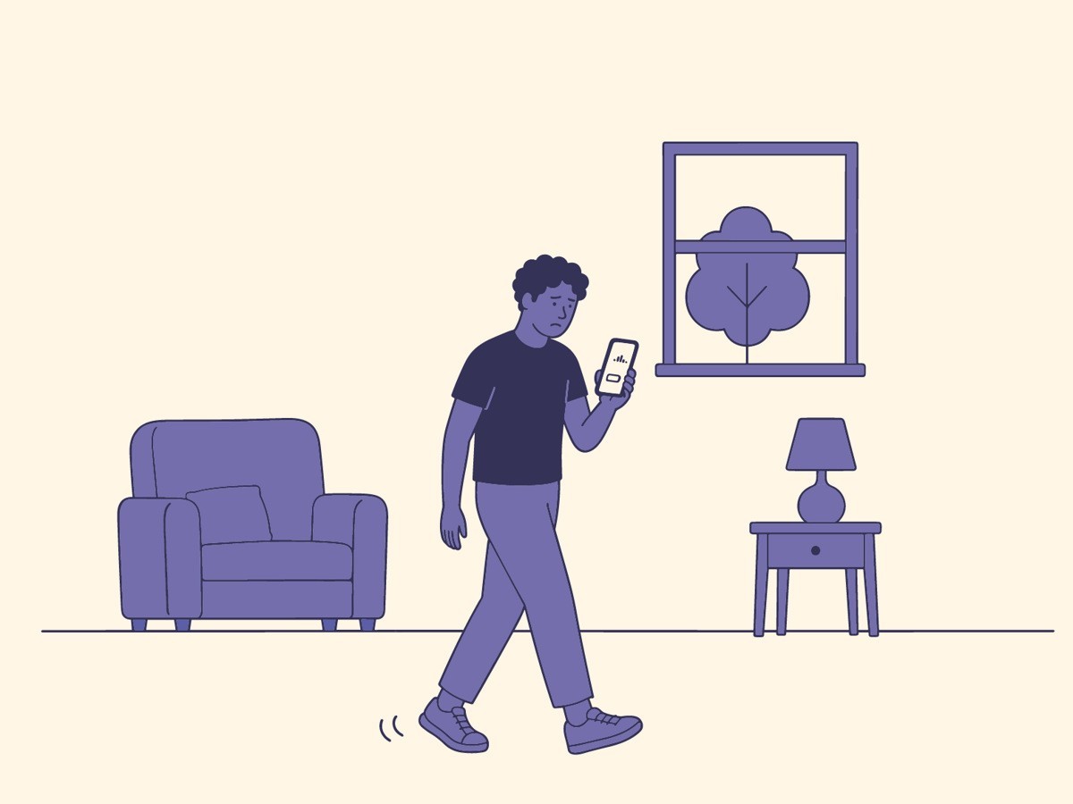 Illustrasjon: Student ser på mobil i et hjem
